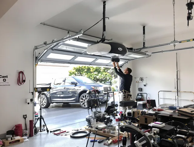 Whitehall Garage Door Repair specialist installing smart garage door opener system in Whitehall home