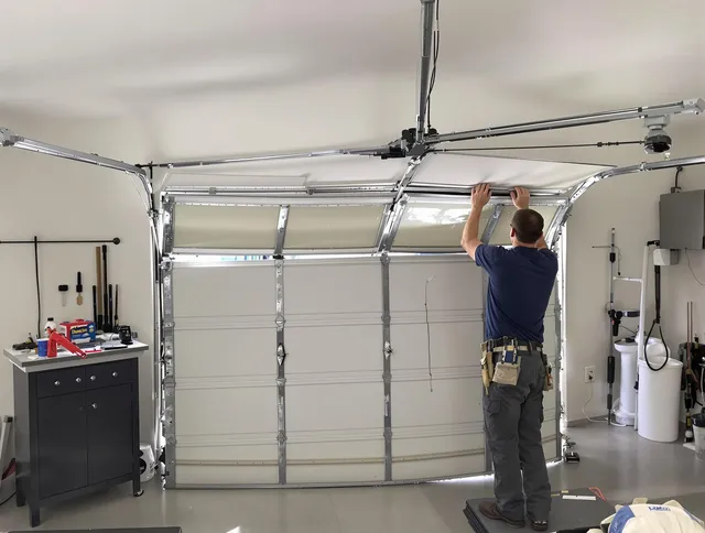 Whitehall Garage Door Repair specialist performing precise section replacement on Whitehall garage door