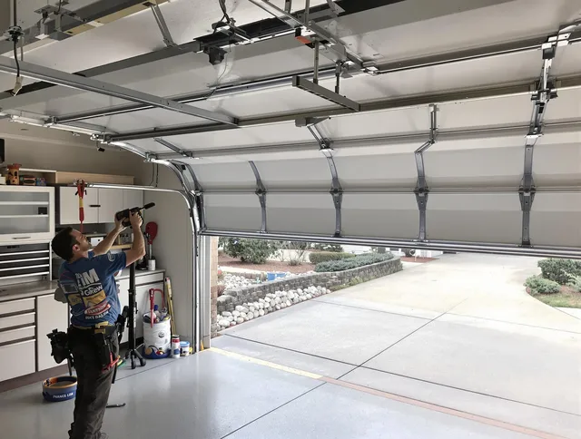 Garage door track repair service by Whitehall Garage Door Repair in Whitehall
